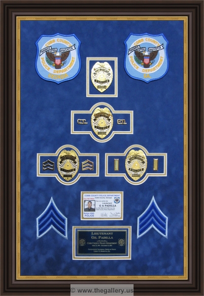 Cobb County Police Department retirement shadow box with police badges, patches, ID cards and lapel pins.


police shadow box ideas



The Gallery at Brookwood
www.thegallery.us
770-941-3394
Your Custom Framing Expert
Picture Framing Examples
Custom Framing Examples
Shadowbox Examples
Police_Department_retirement_shadow_box_with_badge