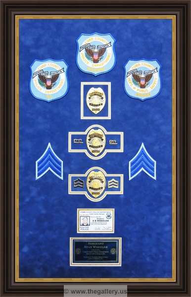 Cobb County Police Department retirement shadow box with police badges, patches, ID cards and lapel pins.






The Gallery at Brookwood
www.thegallery.us
770-941-3394
Your Custom Framing Expert
Picture Framing Examples
Custom Framing Examples
Shadowbox Examples
Police_Department_retirement_shadow_box_with_badges_pins