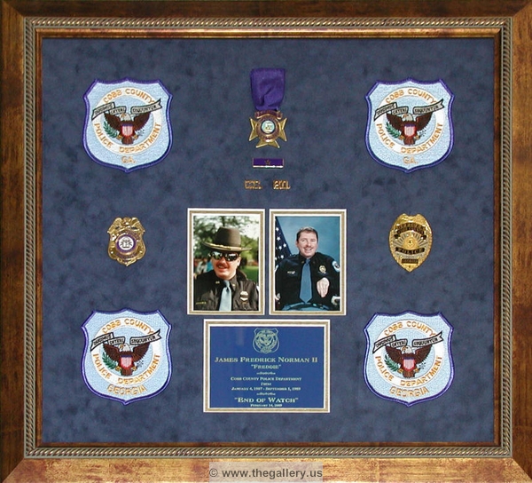 Cobb County Police Department shadow box with police badges, patches, ID cards and lapel pins.






The Gallery at Brookwood
www.thegallery.us
770-941-3394
Your Custom Framing Expert
Picture Framing Examples
Custom Framing Examples
Shadowbox Examples
ccpd_award