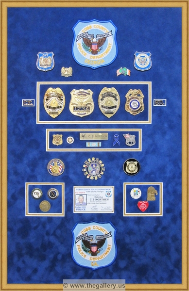 Cobb County Police Department retirement shadow box with police badges, patches, ID cards and lapel pins.


military shadow box layouts, military shadow box plans, how to build a military shadow box display case, military shadow box near me, military shadow box ideas, military shadow box display case, military shadow box with uniform, military shadow box with flag, 



The Gallery at Brookwood
www.thegallery.us
770-941-3394
Your Custom Framing Expert
Picture Framing Examples
Custom Framing Examples
Shadowbox Examples
cobb-county-police-shadow-box-retirement