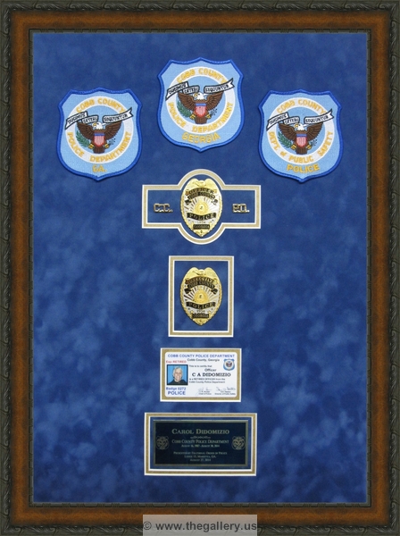 Police Department retirement shadow box with police badges, patches, ID cards and lapel pins.






The Gallery at Brookwood
www.thegallery.us
770-941-3394
Your Custom Framing Expert
Picture Framing Examples
Custom Framing Examples
Shadowbox Examples
custom_made_Police_Department_retirement_shadow_box_with_badges