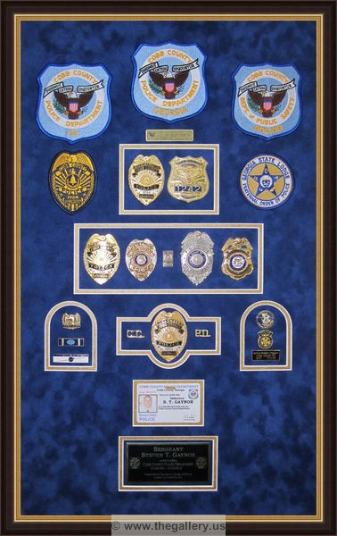 Cobb County Police Department retirement shadow box with police badges, patches, ID cards and lapel pins.


Police Department retirement shadow box examples



The Gallery at Brookwood
www.thegallery.us
770-941-3394
Your Custom Framing Expert
Picture Framing Examples
Custom Framing Examples
Shadowbox Examples
police_shadow_box_cobb_county