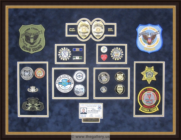  Police Department retirement shadowbox with police badges, patches, ID cards and lapel pins.


military shadow box with flag, 



The Gallery at Brookwood
www.thegallery.us
770-941-3394
Your Custom Framing Expert
Picture Framing Examples
Custom Framing Examples
Shadowbox Examples
texture3_50109851_24