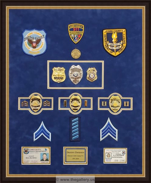  Police Department retirement shadowbox with police badges, patches, ID cards and lapel pins.






The Gallery at Brookwood
www.thegallery.us
770-941-3394
Your Custom Framing Expert
Picture Framing Examples
Custom Framing Examples
Shadowbox Examples
texture4_48762396_25