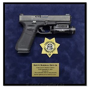 Sheriff  Department retirement gun shadow box examples

The Gallery at Brookwood
www.thegallery.us
770-941-3394
Your Custom Framing Expert
Picture Framing Examples
Custom Framing Examples
Shadowbox Examples