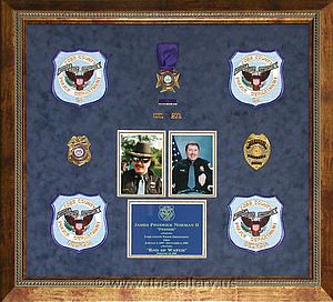 Cobb County Police Department shadow box with police badges, patches, ID cards and lapel pins.

The Gallery at Brookwood
www.thegallery.us
770-941-3394
Your Custom Framing Expert
Picture Framing Examples
Custom Framing Examples
Shadowbox Examples