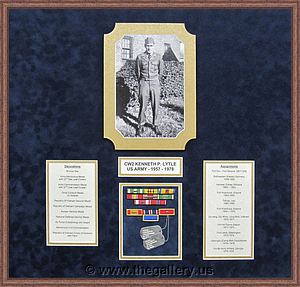 Military shadow box with pins, patches, and certificate.

The Gallery at Brookwood
www.thegallery.us
770-941-3394
Your Custom Framing Expert
Picture Framing Examples
Custom Framing Examples
Shadowbox Examples