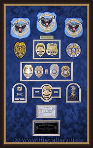 Cobb County Police Department retirement shadow box with police badges, patches, ID cards and lapel pins.

The Gallery at Brookwood
www.thegallery.us
770-941-3394
Your Custom Framing Expert
Picture Framing Examples
Custom Framing Examples
Shadowbox Examples