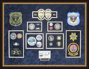  Police Department retirement shadowbox with police badges, patches, ID cards and lapel pins.

The Gallery at Brookwood
www.thegallery.us
770-941-3394
Your Custom Framing Expert
Picture Framing Examples
Custom Framing Examples
Shadowbox Examples