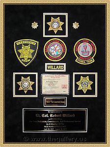 Police Department retirement shadow box with police badges, patches, ID cards and lapel pins.

The Gallery at Brookwood
www.thegallery.us
770-941-3394
Your Custom Framing Expert
Picture Framing Examples
Custom Framing Examples
Shadowbox Examples